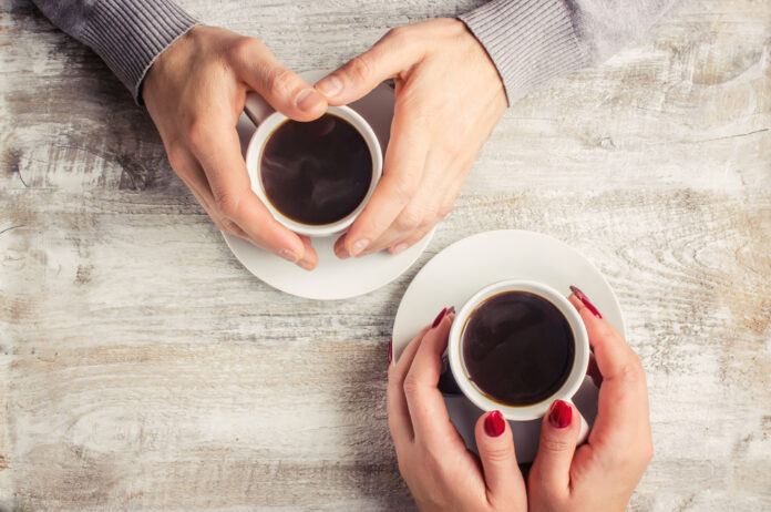 Hot,Coffee,In,The,Hands,Of,A,Loved,One.
