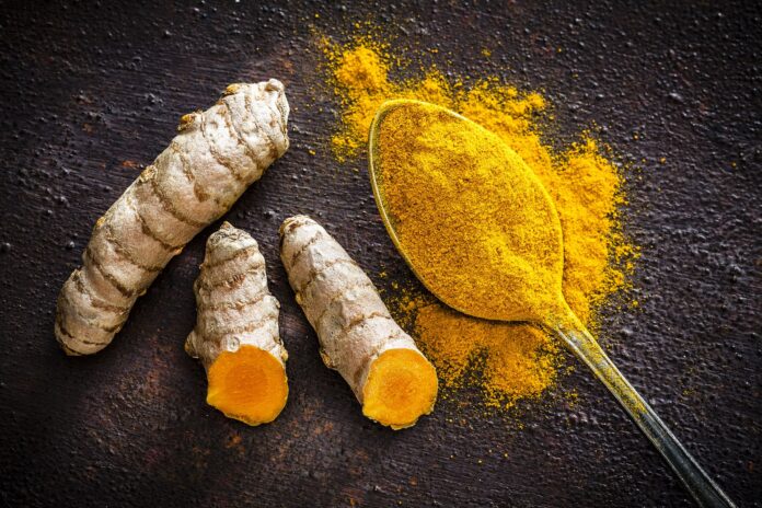 turmeric-roots-and-powder-shot-from-above-royalty-free-image-1588089678
